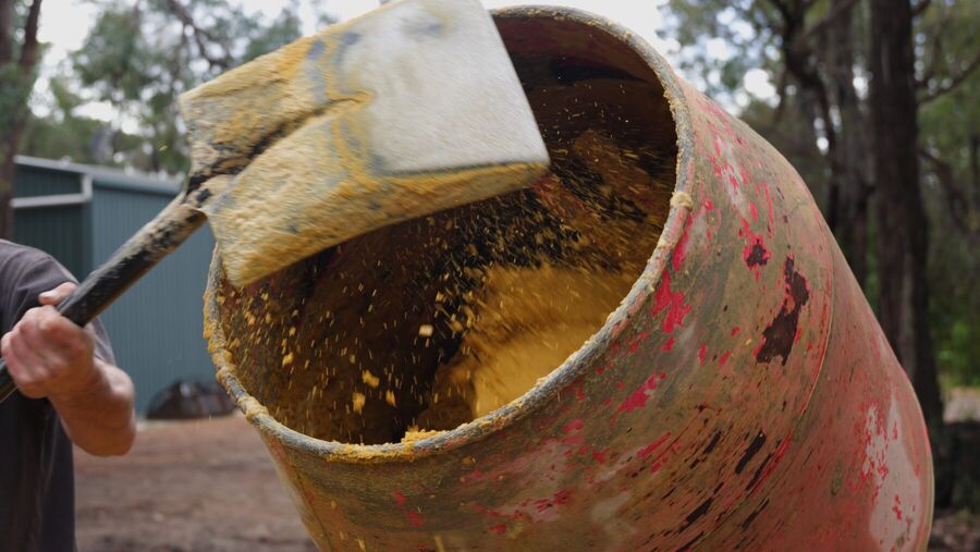 Mortar being poured from a mixer on site
